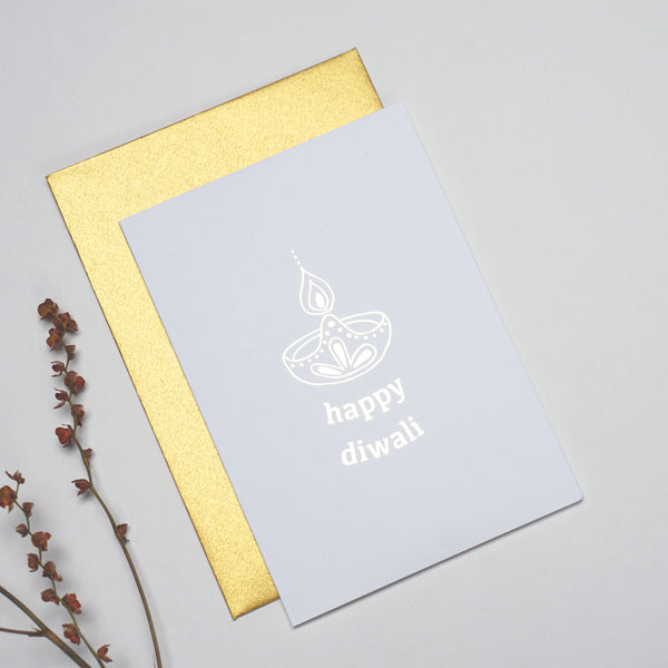 antdesigngifts.co.uk Diwali card in gold foil. With diya design with Happy Diwali text. Handprinted in our studio. Supplied with a luxury gold envelope 